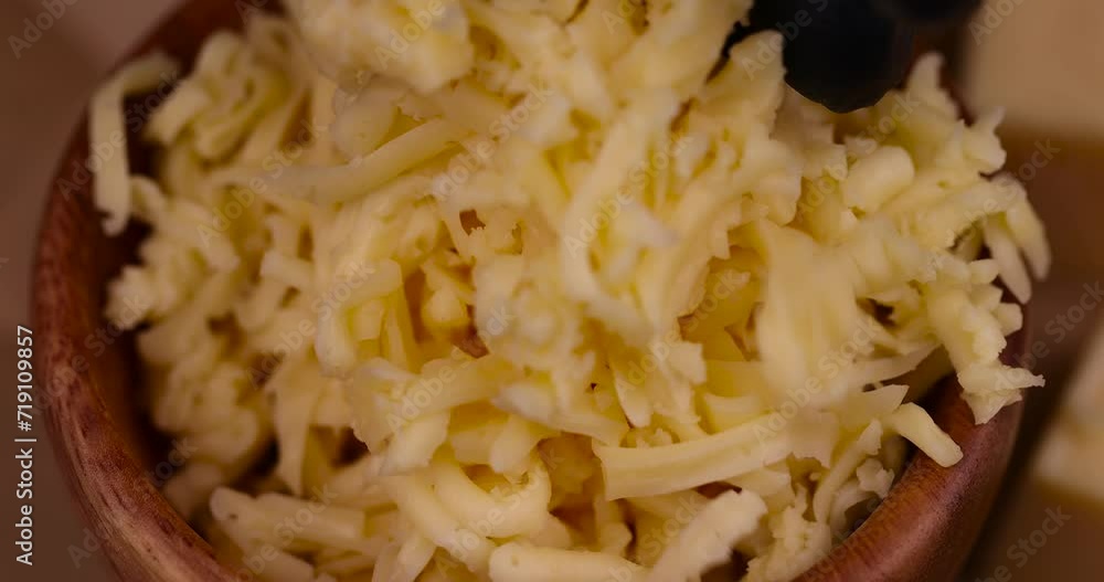 grated cheese in large quantities at home, grated cheese for cooking in the kitchen grated cheese in large quantities at home, grated cheese for cooking in the kitchen