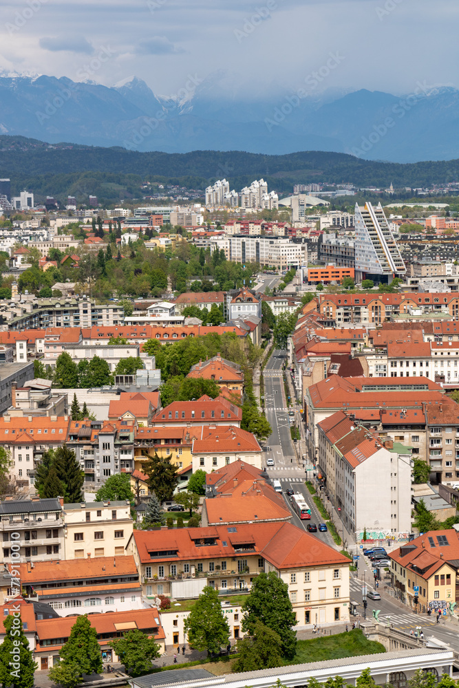 Beautiful views of the city of Ljubljana and the snow-capped mountains of the Julian Alps in the background. From above the Ljubljana castle, Ljubljanski grad, Slovenia.