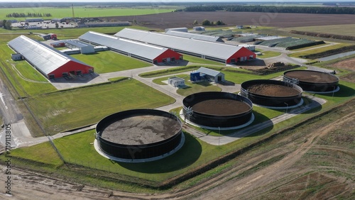 Huge cisterns, collectors, tanks to collect manure and farm waste (cows, rams, bulls, goats, pigs). Ecological processing of manure for biologically pure fertilizers for fields and crops. photo