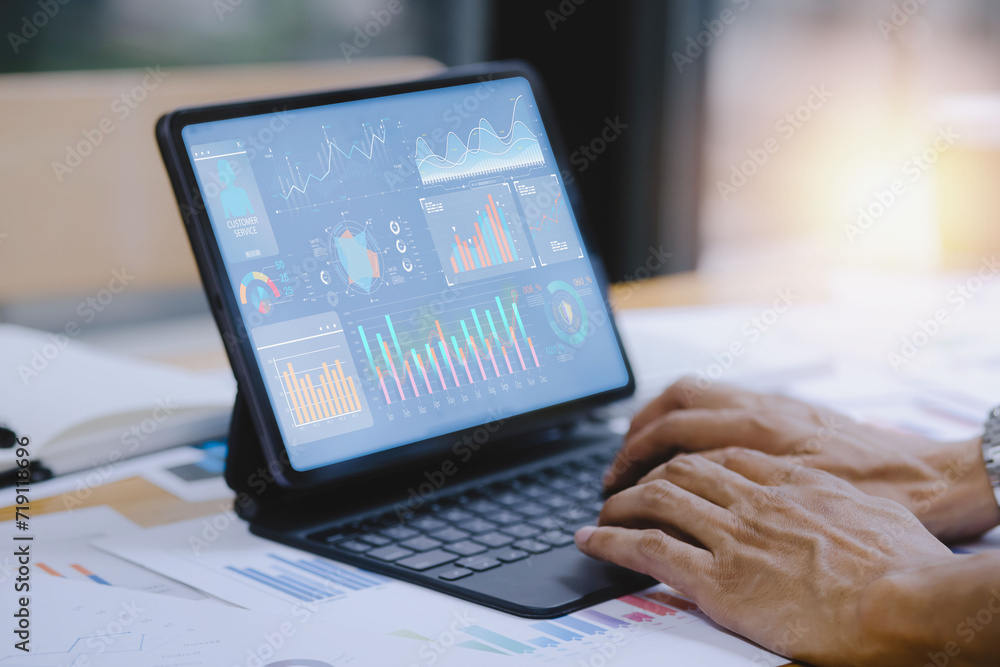 Business hands working on digital tablet with business infographic data concept, Analytics data dashboard. Business hands working on digital tablet with business infographic data concept, Analytics data dashboard.