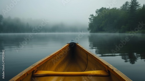 Bow of a canoe in the morning on a misty lake in Ontario, Canada.    © Emil