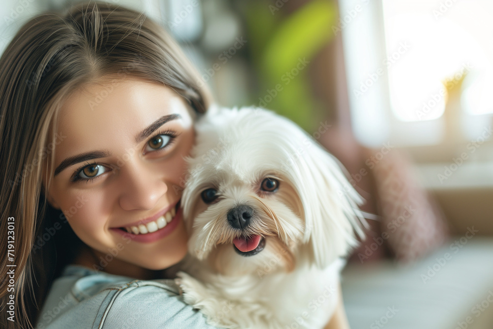 Happy woman with light brown hair hugging her shih tzu dog in a living room Happy woman with light brown hair hugging her shih tzu dog in a living room