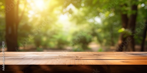 Blurred nature background with a wooden desk.