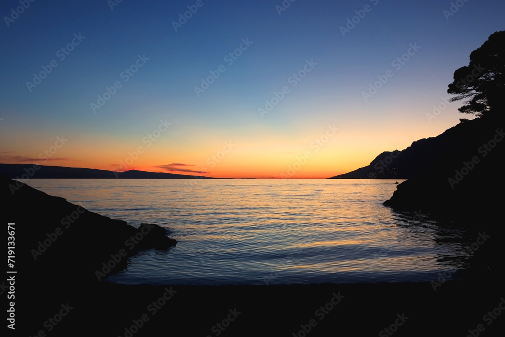 Beautiful sunset on the beach in Brela, Croatia.
