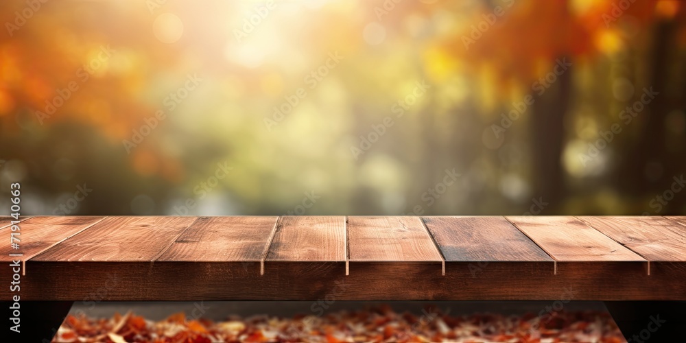 Blurred autumn background with wooden table.