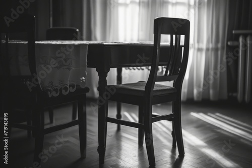 An empty chair at a family dinner table, representing the rejection and estrangement often faced by LGBT+ individuals from their families