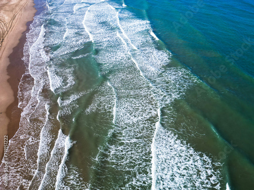 drone view of empty coast , waves crashing beach amazing nature in winter daydrone view of empty coast , waves crashing beach amazing nature in winter day