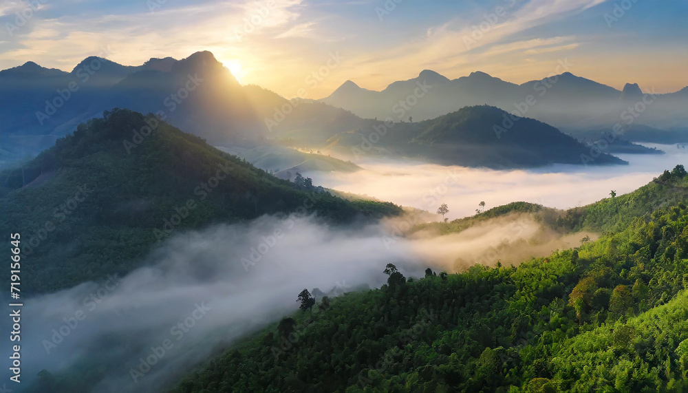 Beautiful green mountain landscape with morning sunrise sky and fog ...