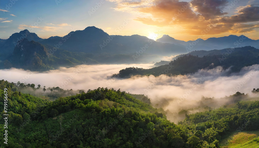Beautiful green mountain landscape with morning sunrise sky and fog. Aerial view of green trees in tropical mountain forests and fog in winter. Nature scene of trees. Green environment background.