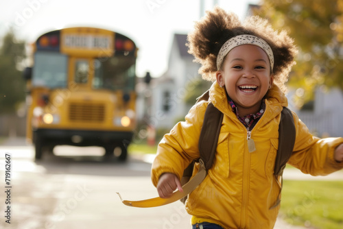 Cheerful Young Student Enjoying After-School Time.
A smiling young student with a backpack runs joyfully with a yellow autumn leaf in hand, a school bus in soft focus behind.