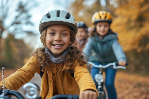 a diverse group of kids enjoying a group bike ride in the autumn park