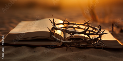 the bible and the crown of thorns among the sands of the desert photo