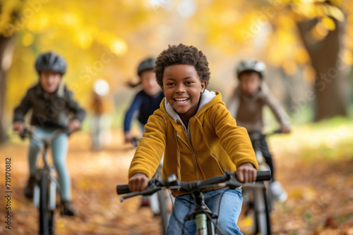 a diverse group of kids enjoying a group bike ride in the autumn park