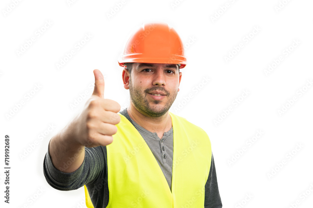 Cheerful male builder smiling making thumb-up like gesture