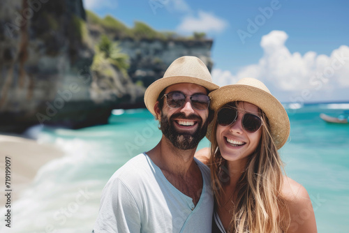 couple on beach for holiday adventure together on tropical island with space © Kien