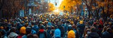 A crowded street in an autumn city at sunset, filled with people in warm clothes. Concept: city life, social events and urban traffic
