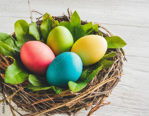 Colorful Nest of Easter Joy. Vibrant Eggs on a White Background