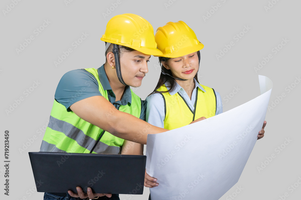 Asian Couple Engineer & Architect gives gestures and expressions on construction field with laptop Asian Couple Engineer & Architect gives gestures and expressions on construction field with laptop