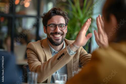 Happy businessman giving high-five to each other