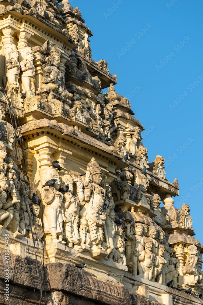Carvings of Hindu deities and figures on the gopuram tower of the Chennakeshava temple in Belur, Karnataka.