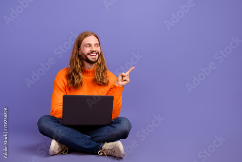 Full body length photo of senior it specialist programmer guy sweater with laptop point finger website isolated on purple color background