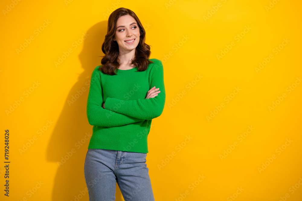 Portrait of nice intelligent lady folded hands beaming smile look empty space isolated on yellow color background Portrait of nice intelligent lady folded hands beaming smile look empty space isolated on yellow color background