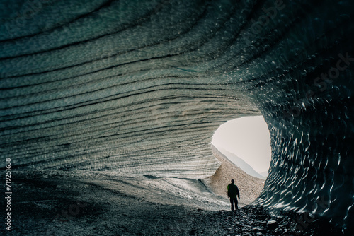 Rounded tunnel ice cave view from the inside. Cueva de Jimbo, Ushuaia, Tierra del Fuego photo