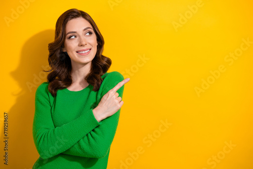 Photo of adorable cute woman wear green stylish sweater recommend buy novelty empty space isolated on yellow color background