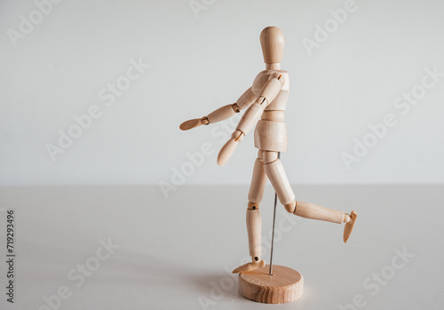 Hip extension on wooden model, Gluteus Maximus, Hamstrings, Biceps Femoris, Semitendinosus muscles photo