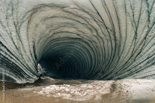 Rounded tunnel ice cave view from the inside. Cueva de Jimbo, Ushuaia, Tierra del Fuego photo