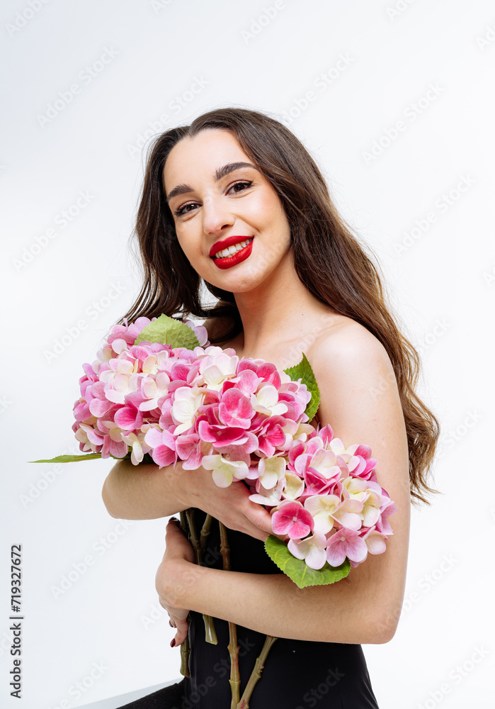 Beautiful young woman with bouquet of flowers Beautiful young woman with bouquet of flowers