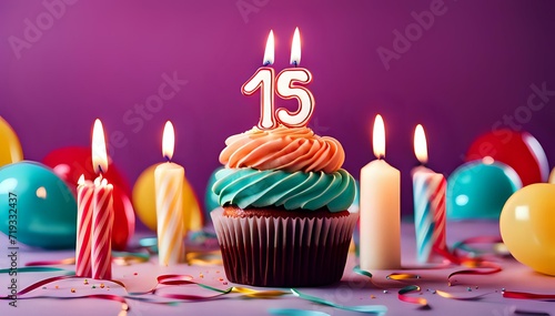 Birthday cupcake with burning lit candle with number 15. Number fifteen for fifteen years or fifteenth anniversary. photo