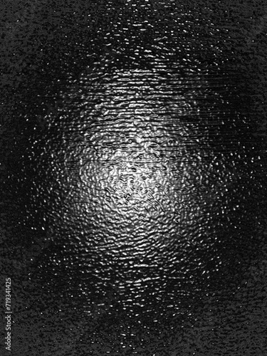 Wrinkled plastic wrap texture on a black background