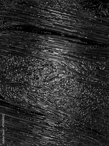 Wrinkled plastic wrap texture on a black background