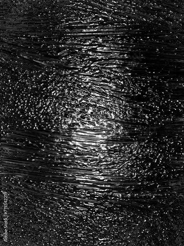Wrinkled plastic wrap texture on a black background