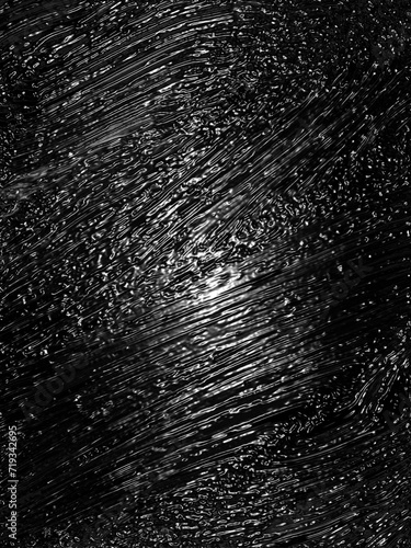 Wrinkled plastic wrap texture on a black background
