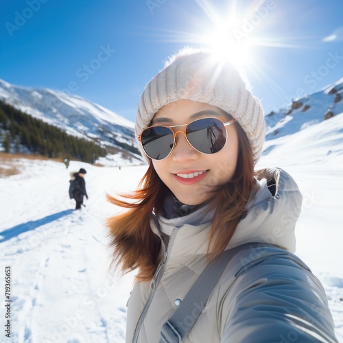 Young woman taking selfie on ice mountain