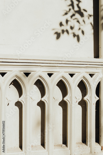 Traditional white wall with decorative balusters