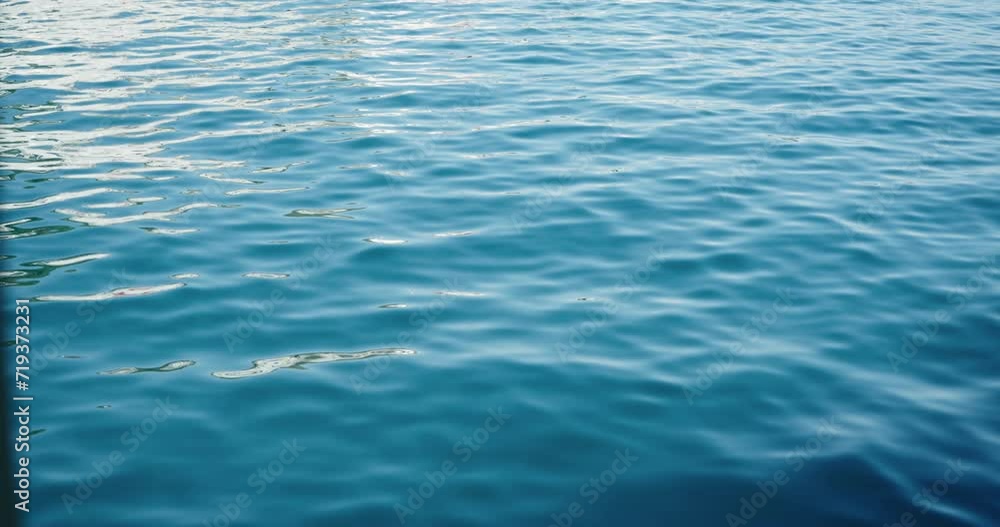 Endless sea surface with sun reflections, slow motion Endless sea surface with sun reflections, slow motion