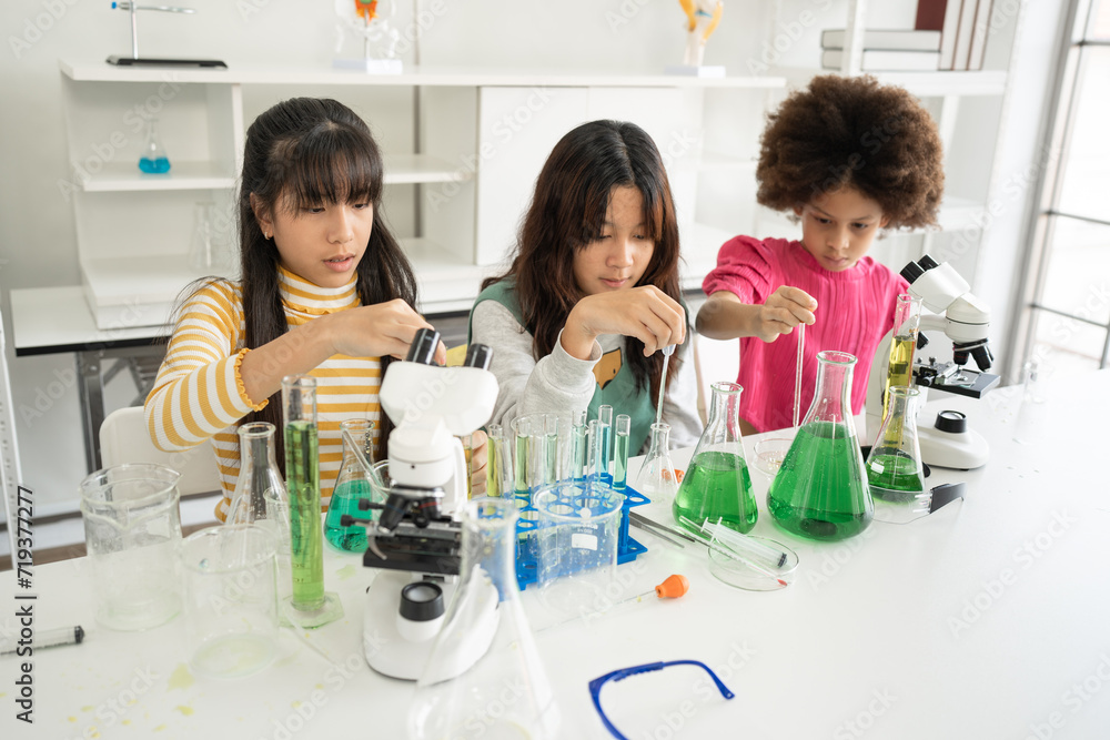 Mix race kid girls funny learning study science of of use microscope and test chemical with tube Mix race kid girls funny learning study science of of use microscope and test chemical with tube