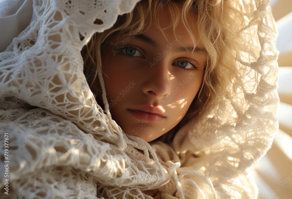 Fototapeta premium A girl with a human face stands indoors, elegantly wearing a white scarf as a symbol of purity and grace