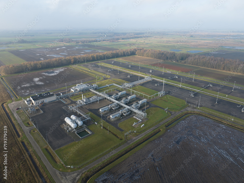 Natural gas fields near Groningen causing earthquakes, Mining of natural resources industrial installation. Birds eye aerial drone view. Natural gas fields near Groningen causing earthquakes, Mining of natural resources industrial installation. Birds eye aerial drone view.