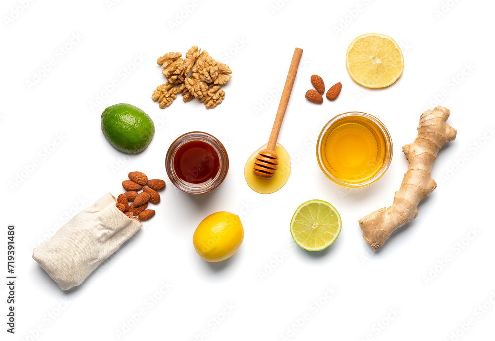 Composition of honey in a jars, lemon, lime, ginger isolated. Composition of honey in a jars, lemon, lime, ginger isolated.