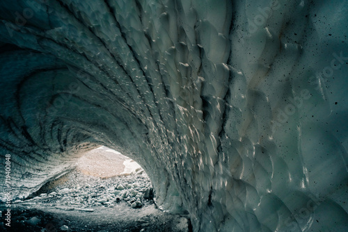 Rounded tunnel ice cave view from the inside. Cueva de Jimbo, Ushuaia, Tierra del Fuego photo