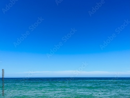 Pure blue sea horizon, blue seascape background, clear sky