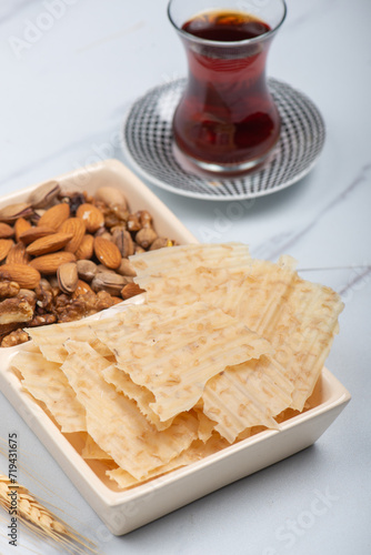 Tarhana chips, Turkish snack made with flour, wheat berries, mint, yogurt and spices also known as frik photo