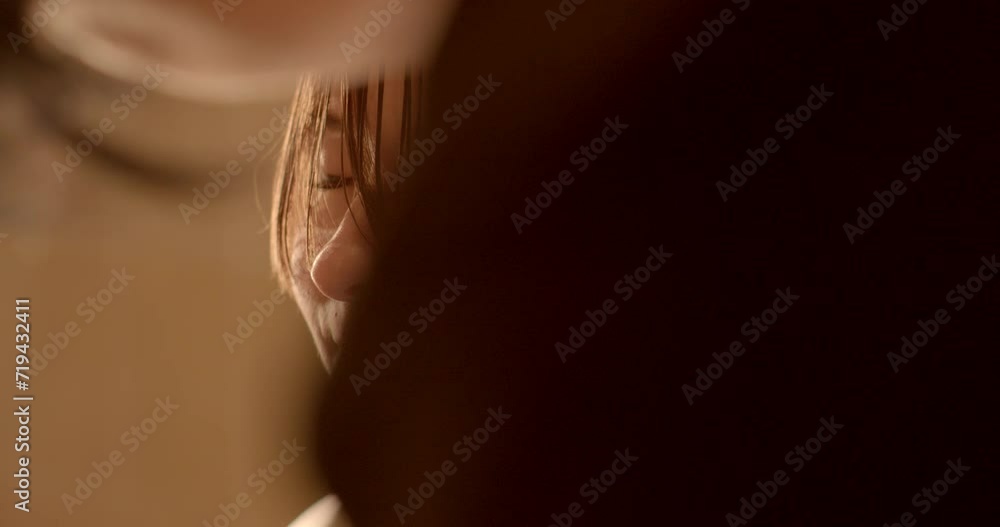 Close-Up young woman portrait during Haircut: Sharp Scissors Trim Hair Strands. Artistry of hairstyling with sharp scissors meticulously trimming hair strands. Skilled stylist working with client. Close-Up young woman portrait during Haircut: Sharp Scissors Trim Hair Strands. Artistry of hairstyling with sharp scissors meticulously trimming hair strands. Skilled stylist working with client.