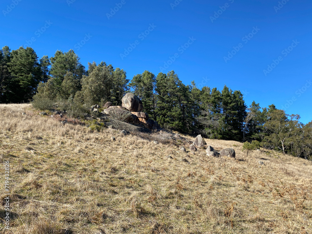 Unusual rock formation in the hill. Sacred rock in the mountains. Rock formation in the land. Historical place. Large rocks piled up in the middle of a field.