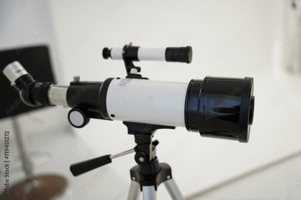 White telescope in the room with no people in the morning. White telescope in the room with no people in the morning.