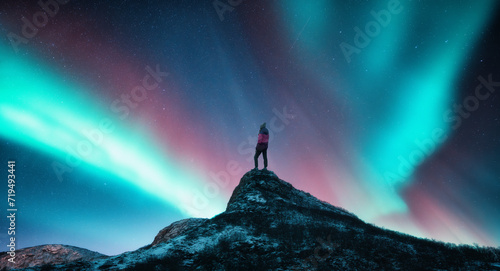 Northern lights and woman o...